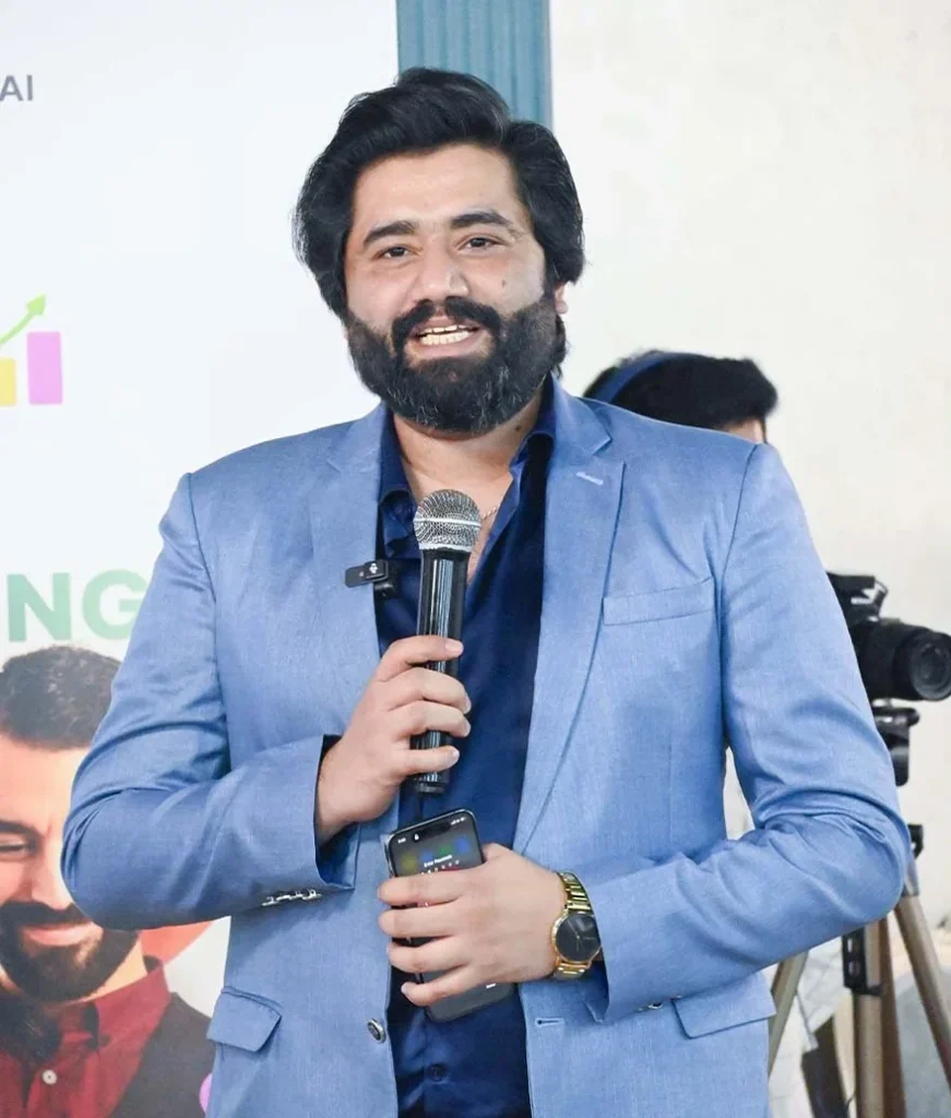 Ayaz Akram Awan speaking on stage at a digital marketing seminar